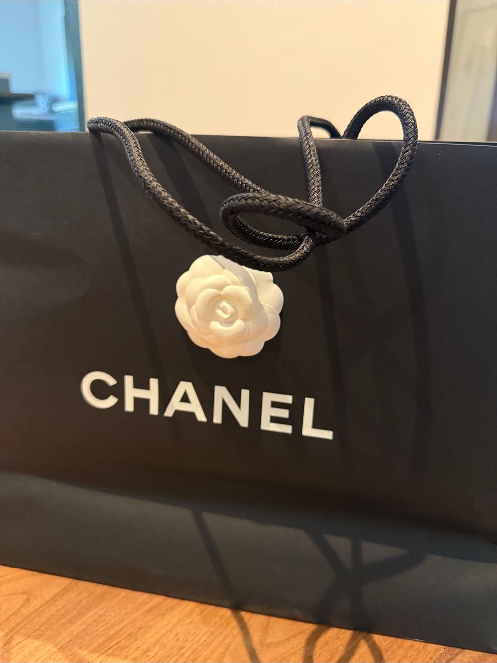 CHANEL Black Shopping Bag with White Camellia Accent